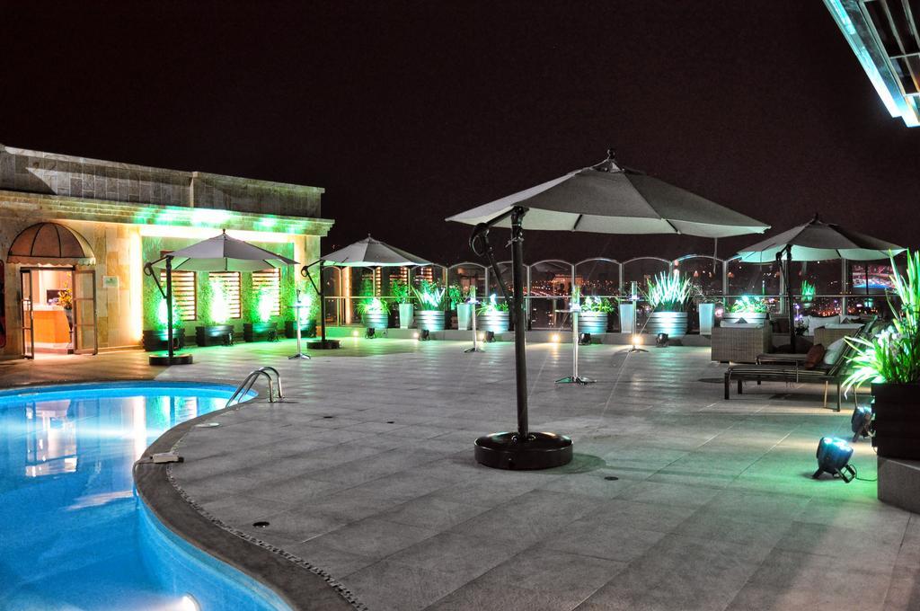 Hotel Dann Carlton บูการามังกา ภายนอก รูปภาพ The pool at the rooftop